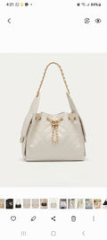 Leather designer's bag by Monroe Lace featuring a sleek, stylish design with top handles and premium leather finish.