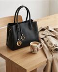 Large black Monroe Lace handbag with three compartments, showing the spacious design and sleek leather exterior.