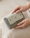 Medium Monroe Lace wallet with multiple card slots and a zip coin compartment, made from smooth leather.