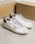 Golden Goose Monroe Lace sneakers with white leather and gold accents, stylishly displayed on a neutral background.