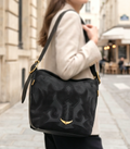 Medium size designer’s bag by Monroe Lace featuring elegant leather with sturdy handles and spacious interior.
