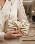 Gold leather evening clutch by Monroe Lace, 20cm by 10cm, with a sleek and elegant design for formal events.
