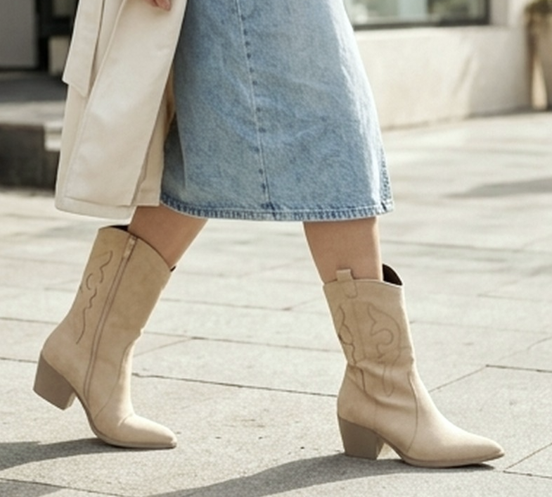 Western suede boots by Monroe Lace featuring classic cowboy style and stitching, with a pointed toe and stacked heel.