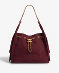 Monroe Lace suede designer's bag with sleek design and elegant stitching, showcasing its textured soft suede material.