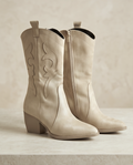 Monroe Lace Western suede boots with pointed toes and stacked heels, featuring classic Western stitching in a tan color.