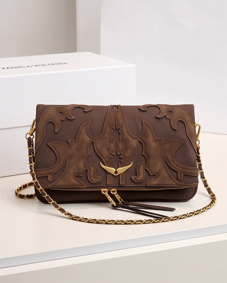 Small Monroe Lace designer bag with elegant leather finish and stylish hardware, perfect for casual or formal wear.