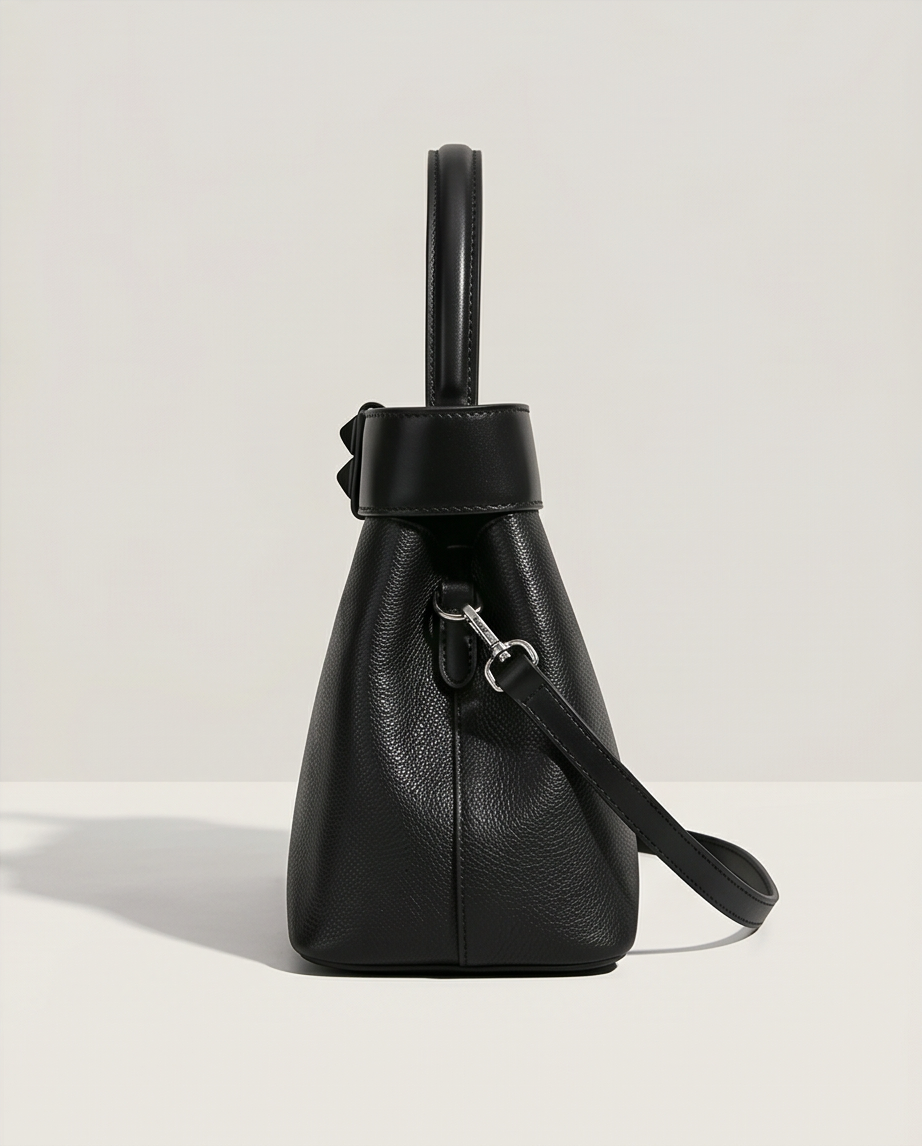 Medium-sized Monroe Lace handbag with 28cm by 21cm dimensions, featuring a stylish design and elegant craftsmanship.