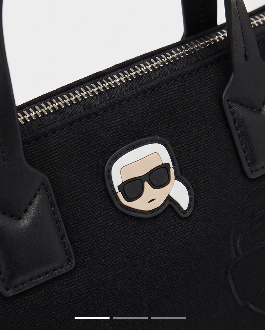 Small Monroe Lace designer's bag with sleek black leather and elegant gold hardware, featuring a compact, stylish design.