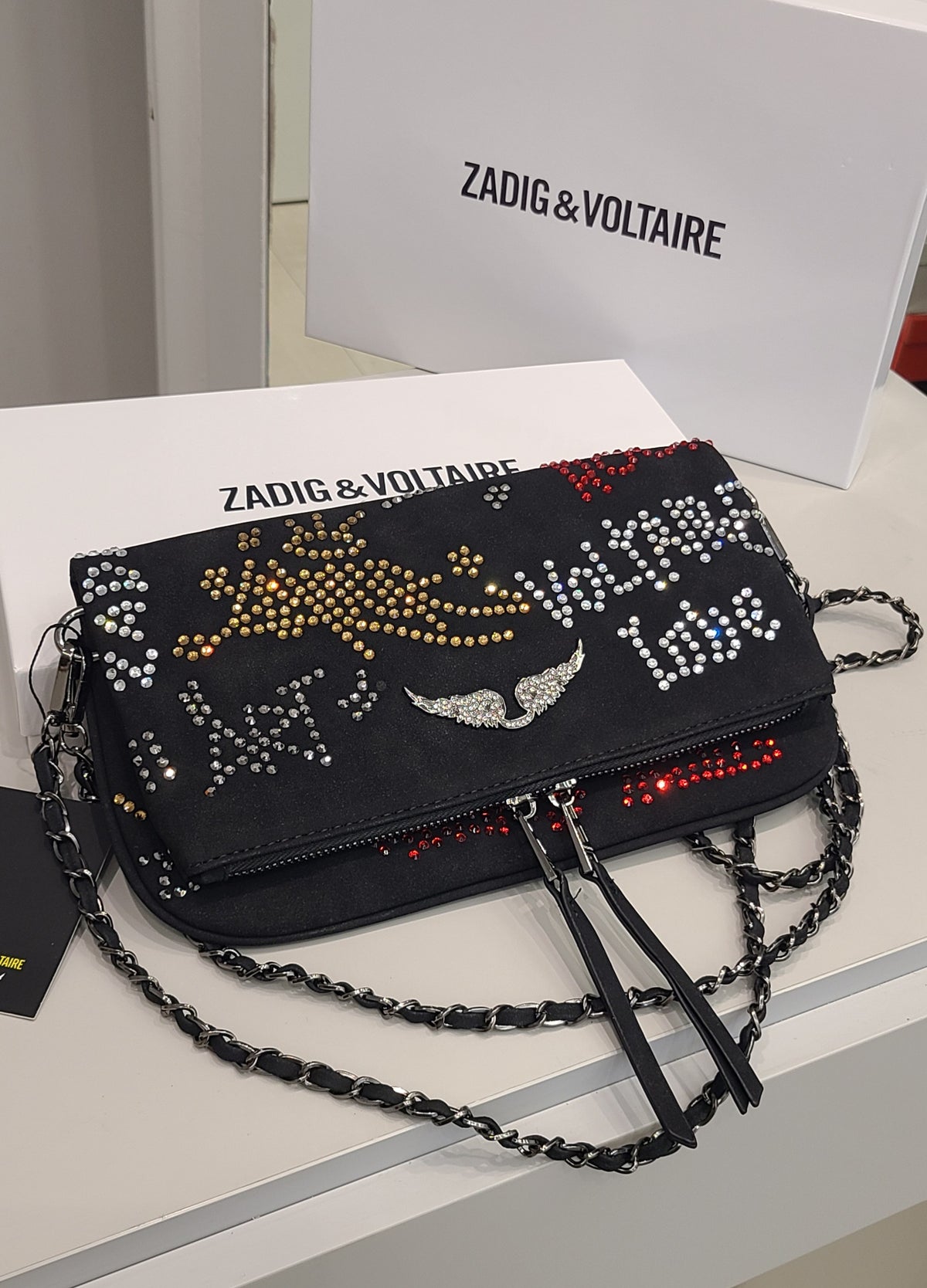Small designer's bag by Monroe Lace featuring a sleek, compact silhouette with stylish detailing and a versatile carry handle.
