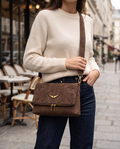 Medium designer's bag by Monroe Lace featuring sleek leather with top handle and spacious interior for stylish everyday use.