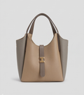 Medium-sized casual handbag by Monroe Lace with top handles and a sleek design, perfect for everyday use.