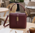 Small elegant bag by Monroe Lace featuring a sleek design, soft material, and a compact size ideal for evening or formal occasions.