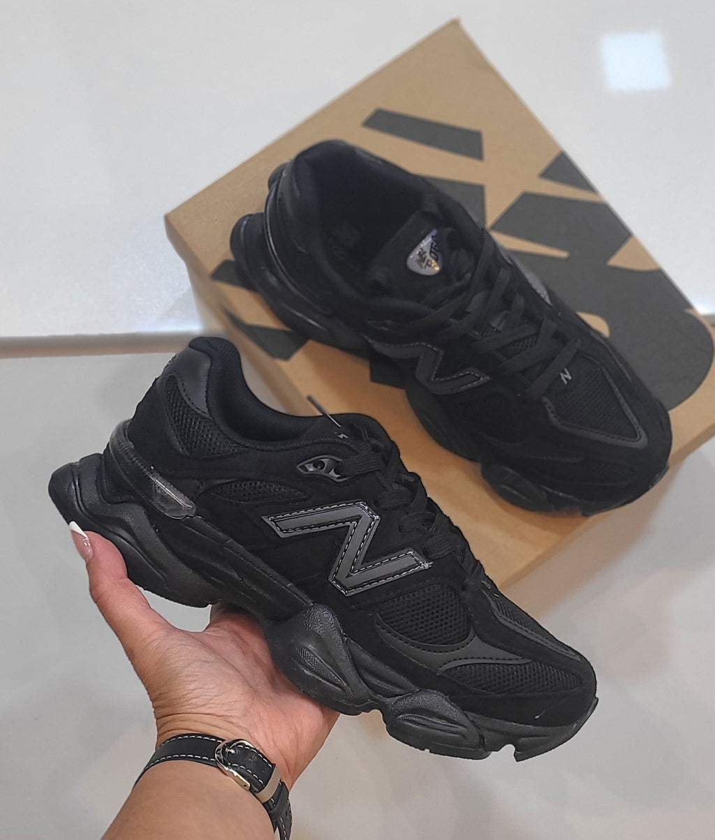 Monroe Lace New Balance 9060 sneakers with stylish gray and white design, featuring breathable mesh and supportive sole.