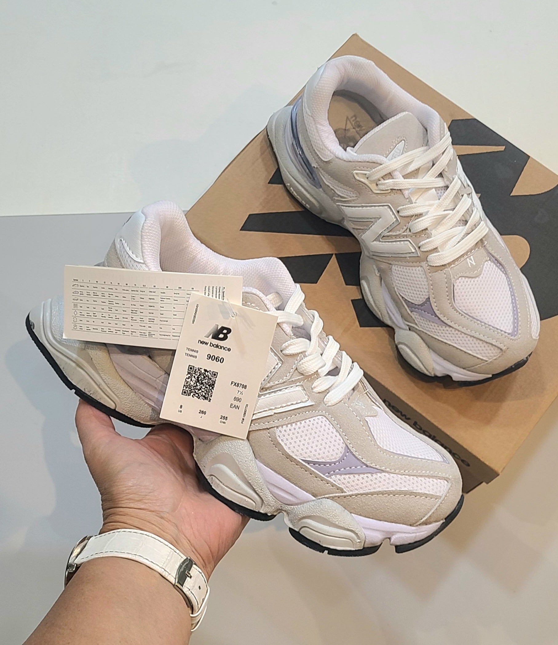 Monroe Lace New Balance 9060 sneakers featuring white and gray design with breathable mesh and supportive sole.