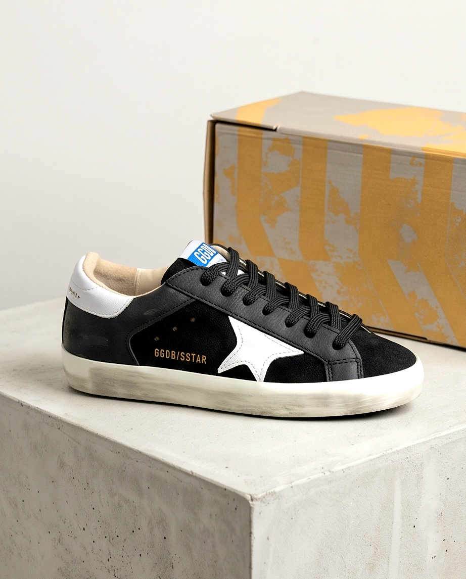Golden Goose Monroe Lace sneakers with white leather and gold accents, featuring signature branding and stylish design.
