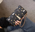 Multifunctional printed wallet by Monroe Lace featuring colorful patterns and multiple card slots, made of durable material.
