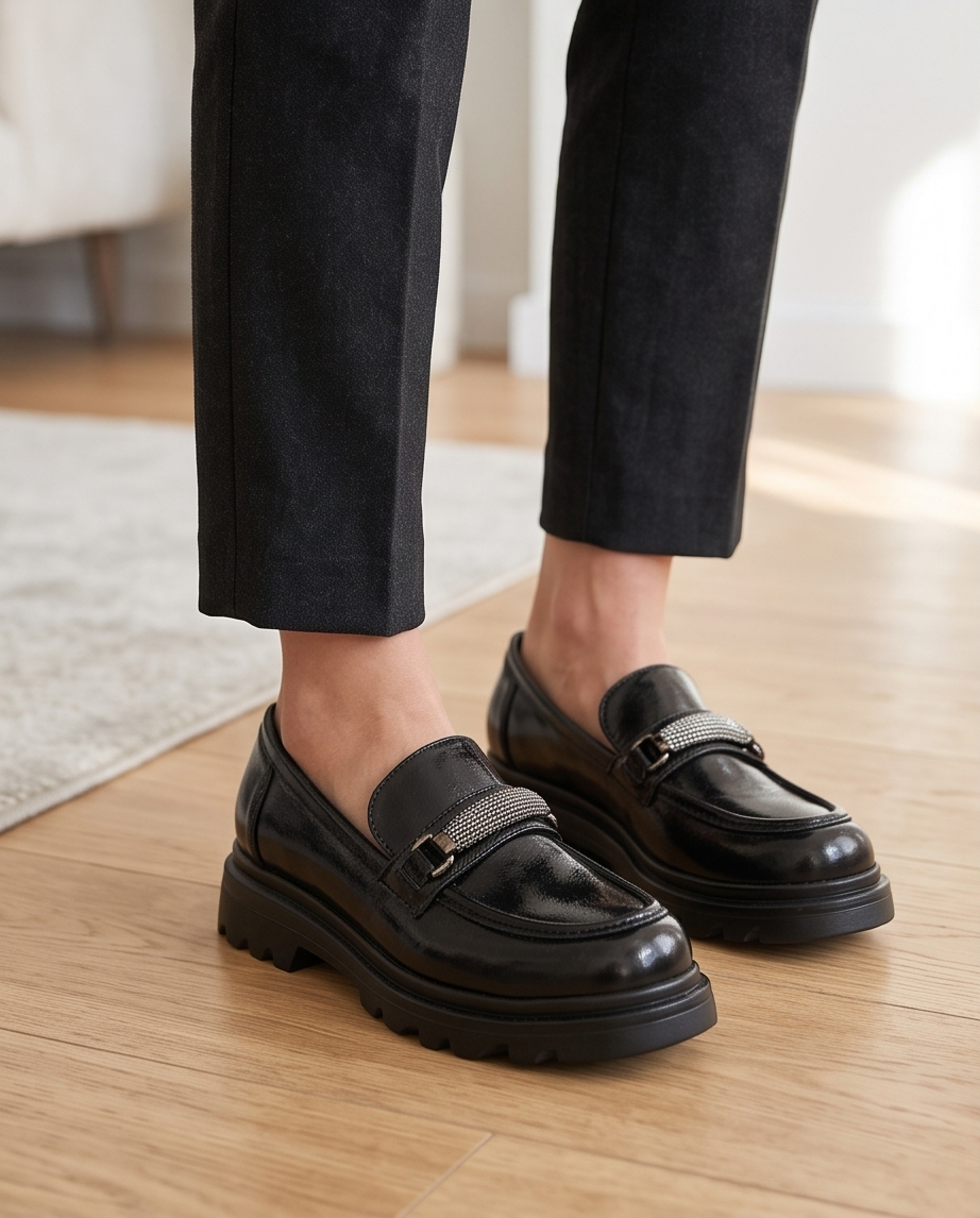 Black Monroe Lace loafers with sleek leather design and classic slip-on style, suitable for casual and formal wear.